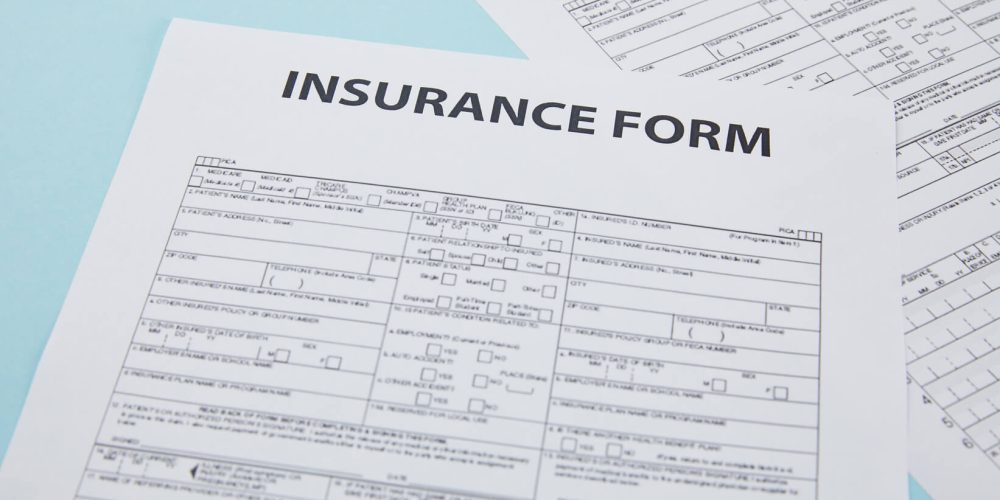 close-up-view-of-insurance-form-on-blue-insurance-2024-11-17-14-34-46-utc (1) (1) close-up-view-of-insurance-form-on-blue-insurance-2024-11-17-14-34-46-utc (1) (1)